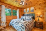 Main Level Bedroom Features a King Bed and Access to Screened Covered Deck